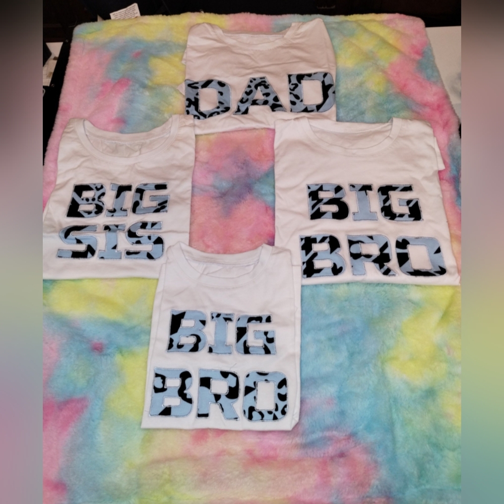 Family shirts and multi color baby blanket
